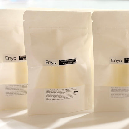 Three white bags of Enyo stain remover stick for menstrual care products and period underwear on a white background