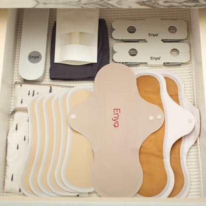 What is included in the Complete Kit? A set of Enyo reusable period care pads and liners with antimicrobial, leakproof, ultra-thin fabrics, plus storage and care accessories.