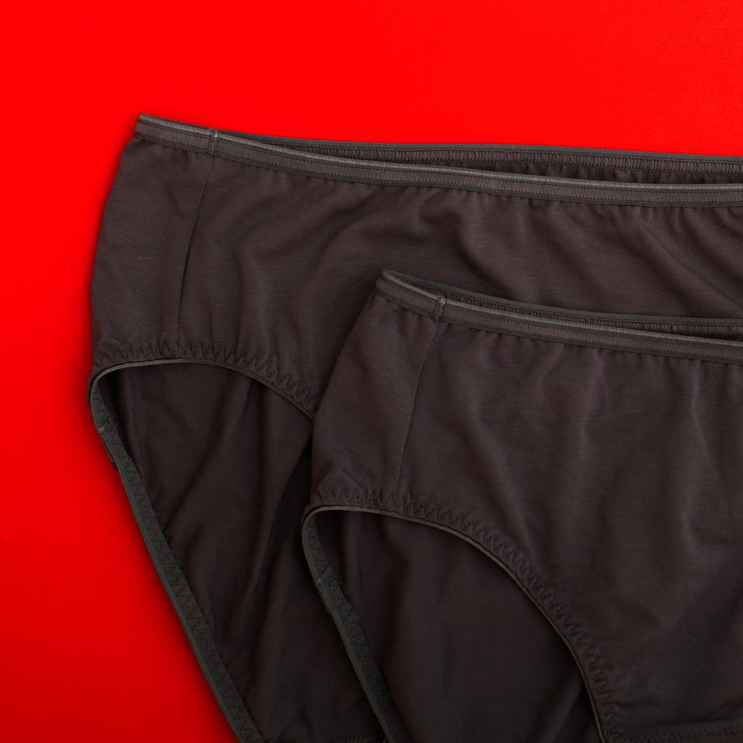 Black underwear on a red background