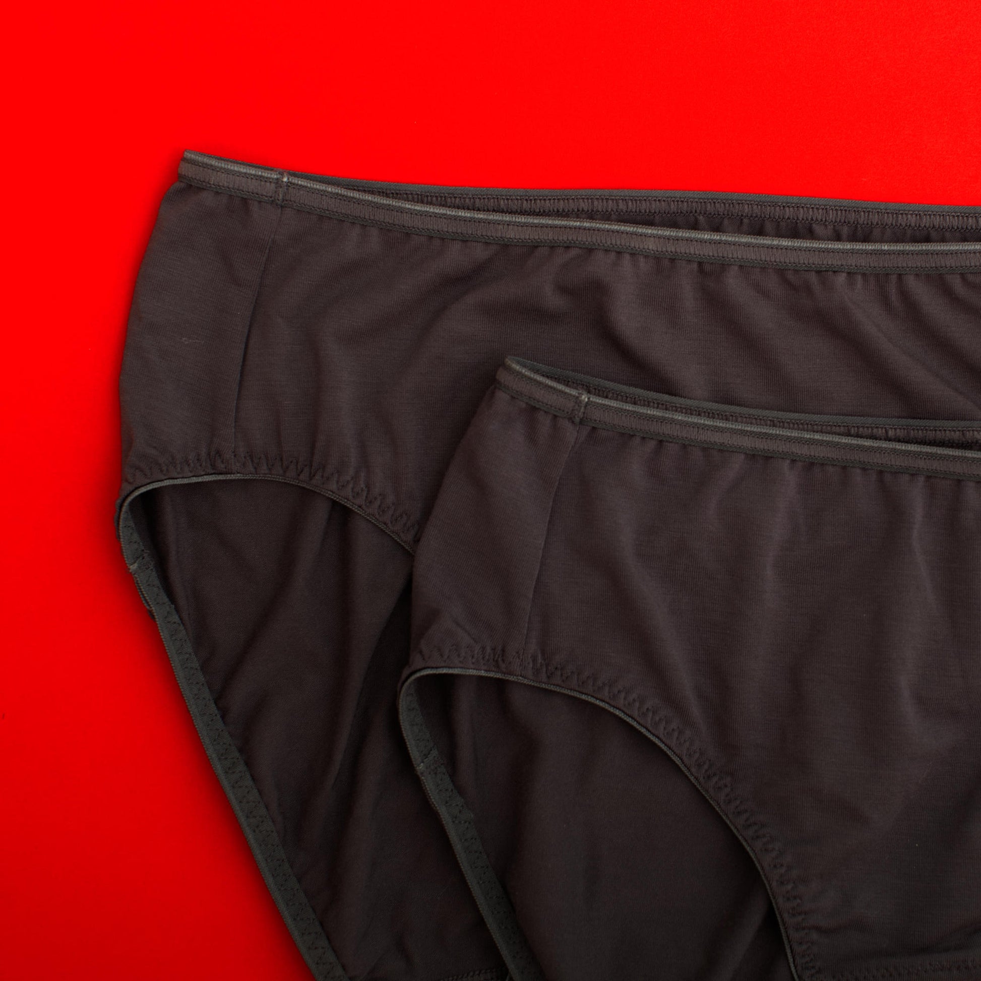 Black underwear on a red background